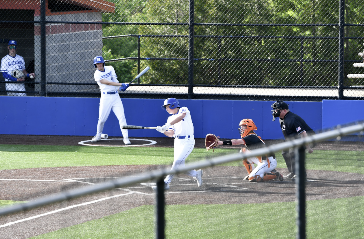 Andrew Forton (9) swings at a ball from the Ryle pitcher. 